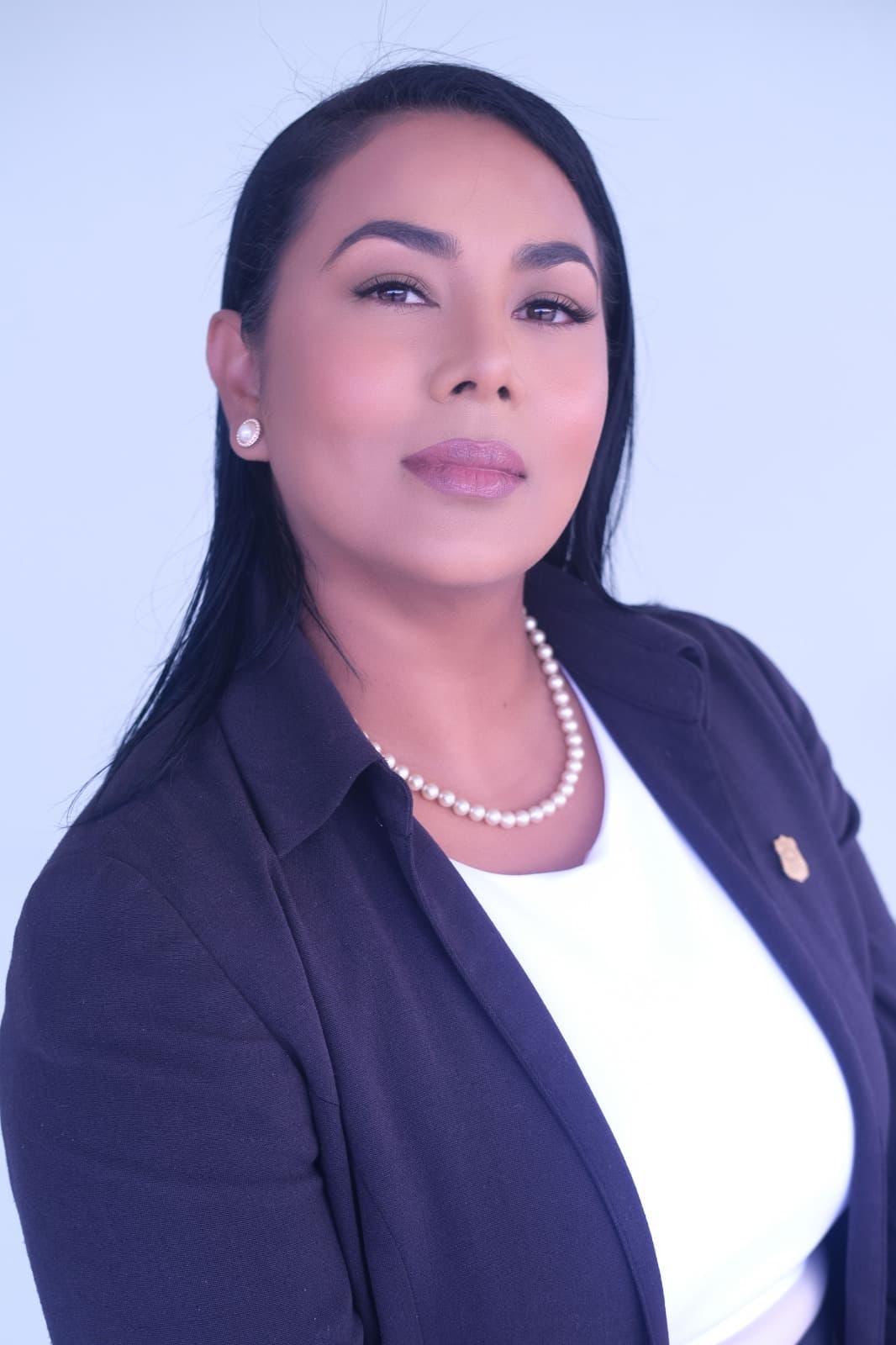 Lead advisor representing the Lady Life Insurance team in professional navy and ivory attire